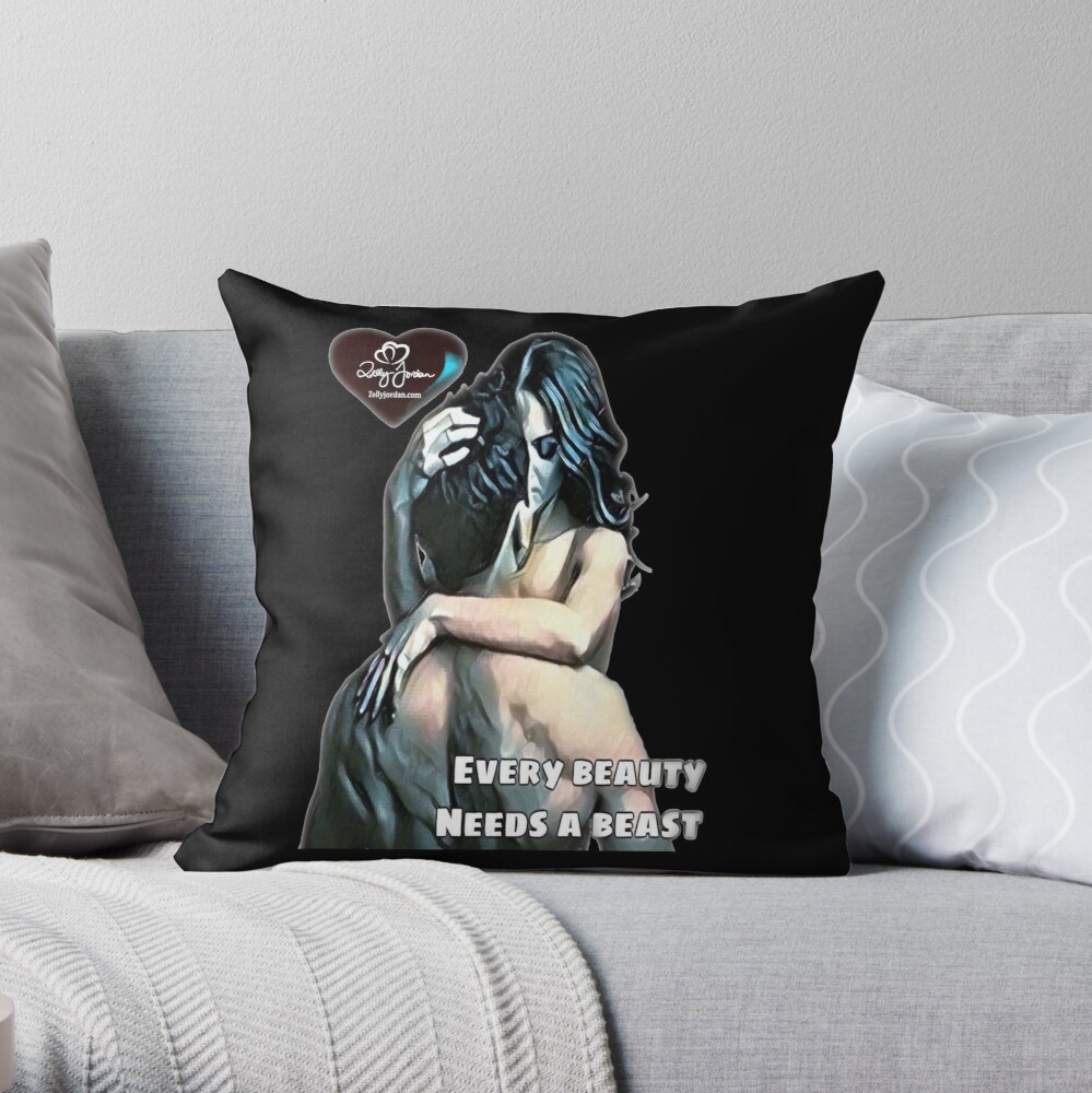 A decorative pillow featuring an artistic illustration of a woman embracing a beast, accompanied by the text 'Every beauty needs a beast' on a dark background.
