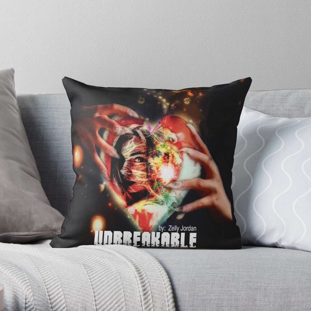 A decorative cushion featuring an artistic design with vibrant colors, showing a heart and abstract elements, titled 'Unbreakable' by Zelly Jordan.