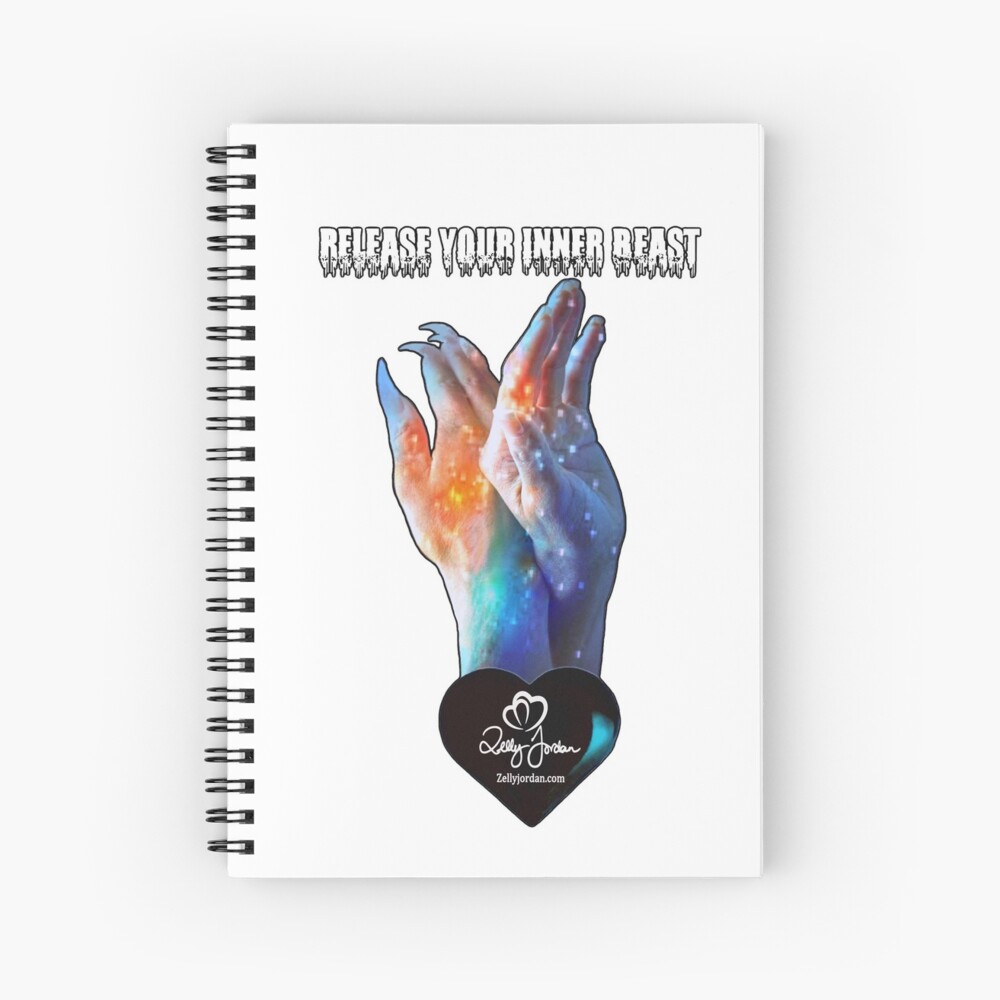 A spiral notebook featuring a cosmic design of two hands in a galaxy theme. The text 'RELEASE YOUR INNER BEAST' is displayed above the hands, along with a logo at the bottom.