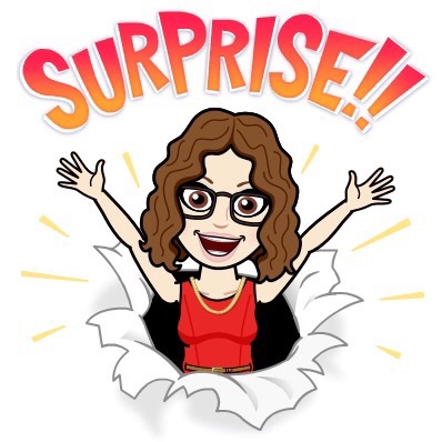 An animated character with curly hair and glasses, wearing a red top, exuberantly announcing 'SURPRISE!!' while breaking through a background.